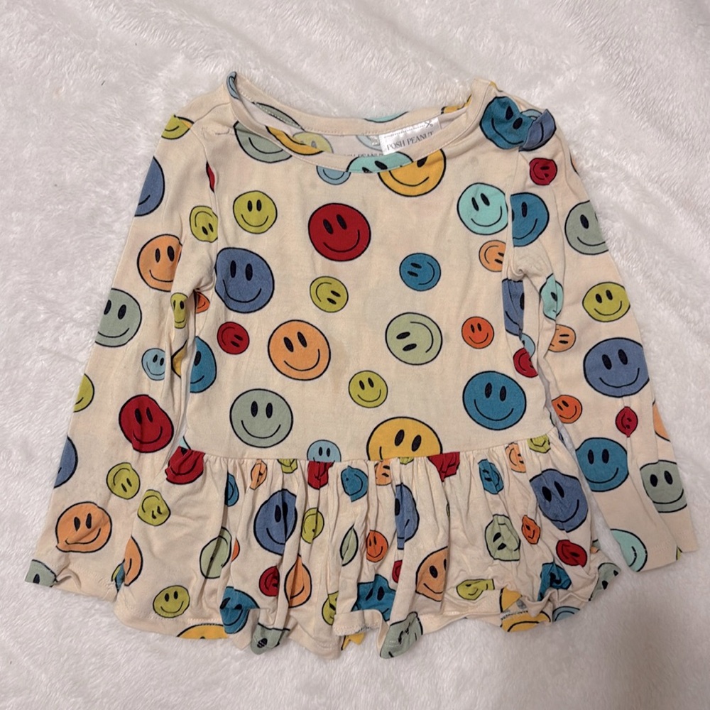 Posh Peanut smiles peplum top